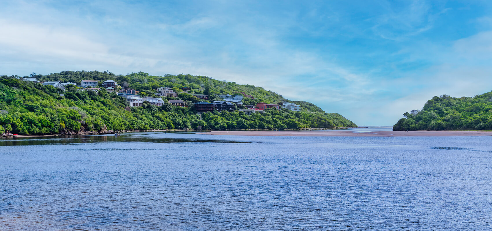 Tranquil waters of Sedgefield lagoon, a serene stop on the Garden Route